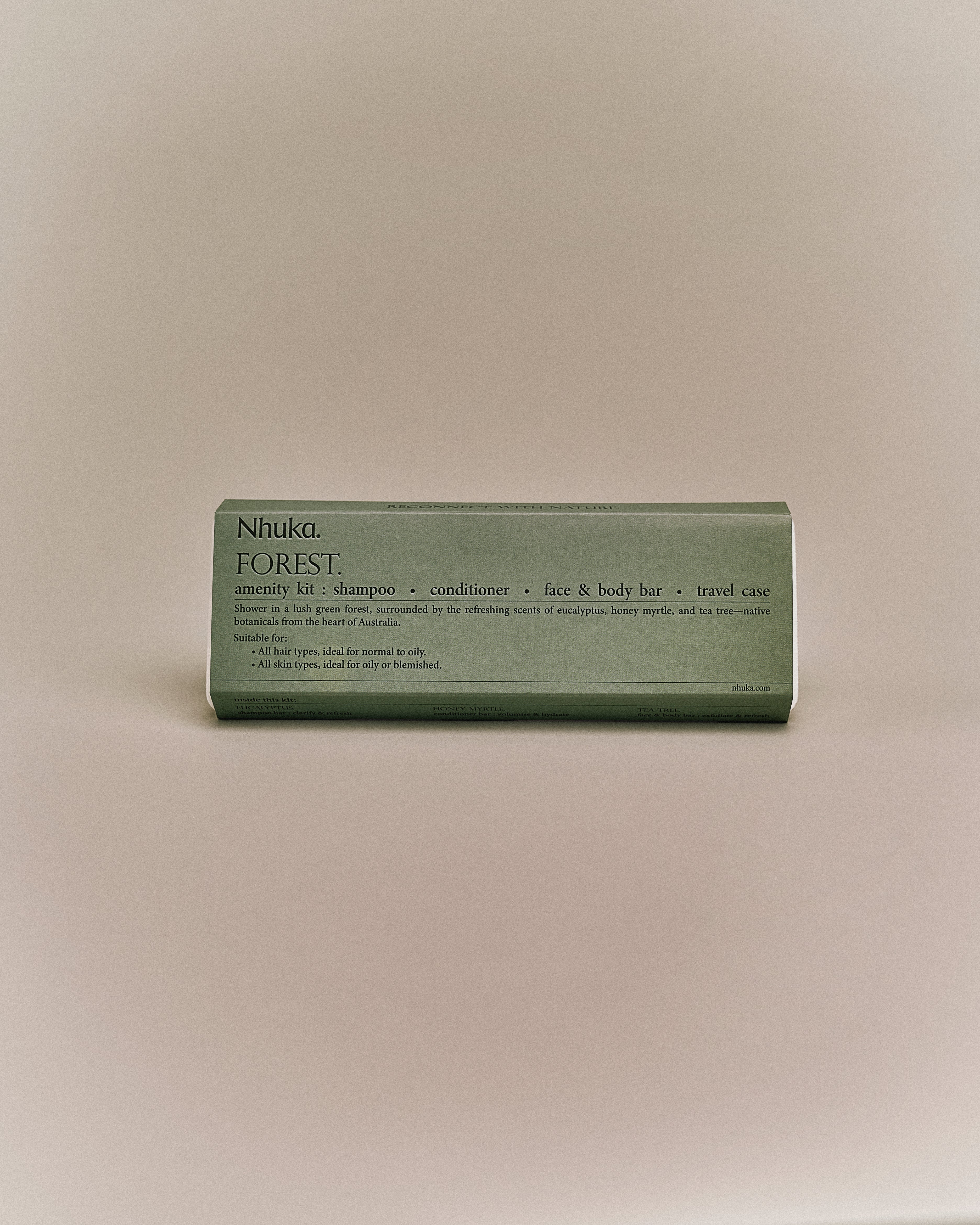 Nhuka Forest Amenity Kit with shampoo, conditioner, face & body bar, and travel case. Features eucalyptus, honey myrtle, and tea tree. Ideal for normal to oily hair and blemish-prone skin.