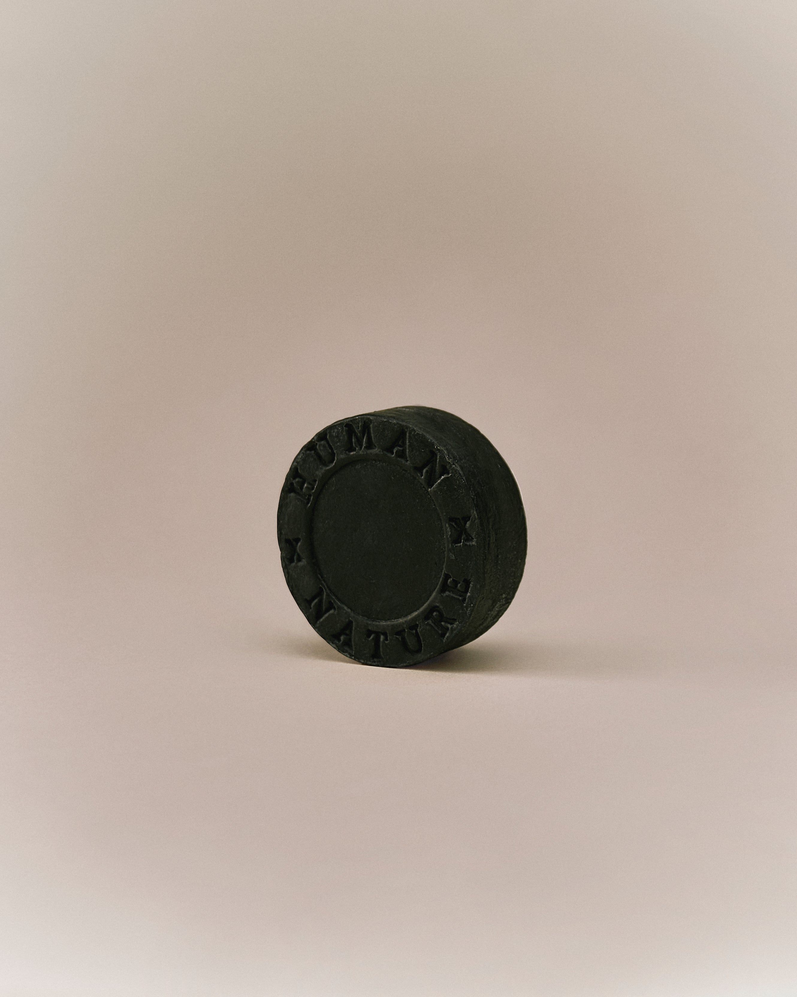 Nhuka eucalyptus shampoo bar photographed at an angle. Solid, pH-balanced, sulfate-free formula for oily hair and scalp care.