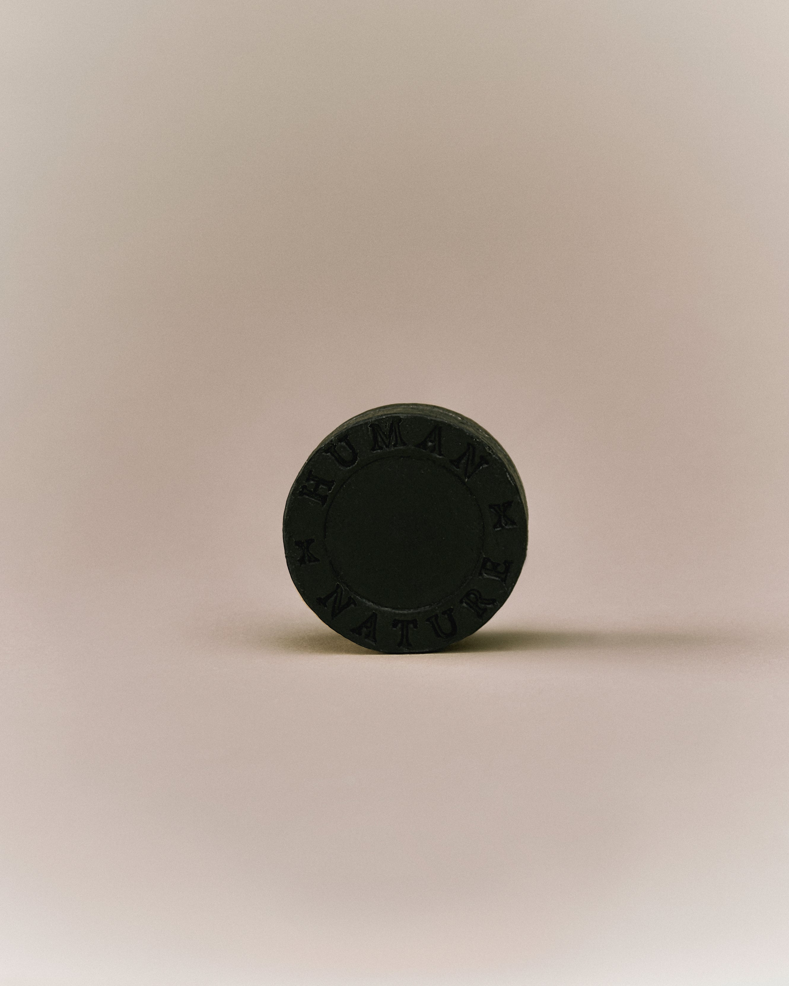 Nhuka organic eucalyptus shampoo bar shown front-facing with &