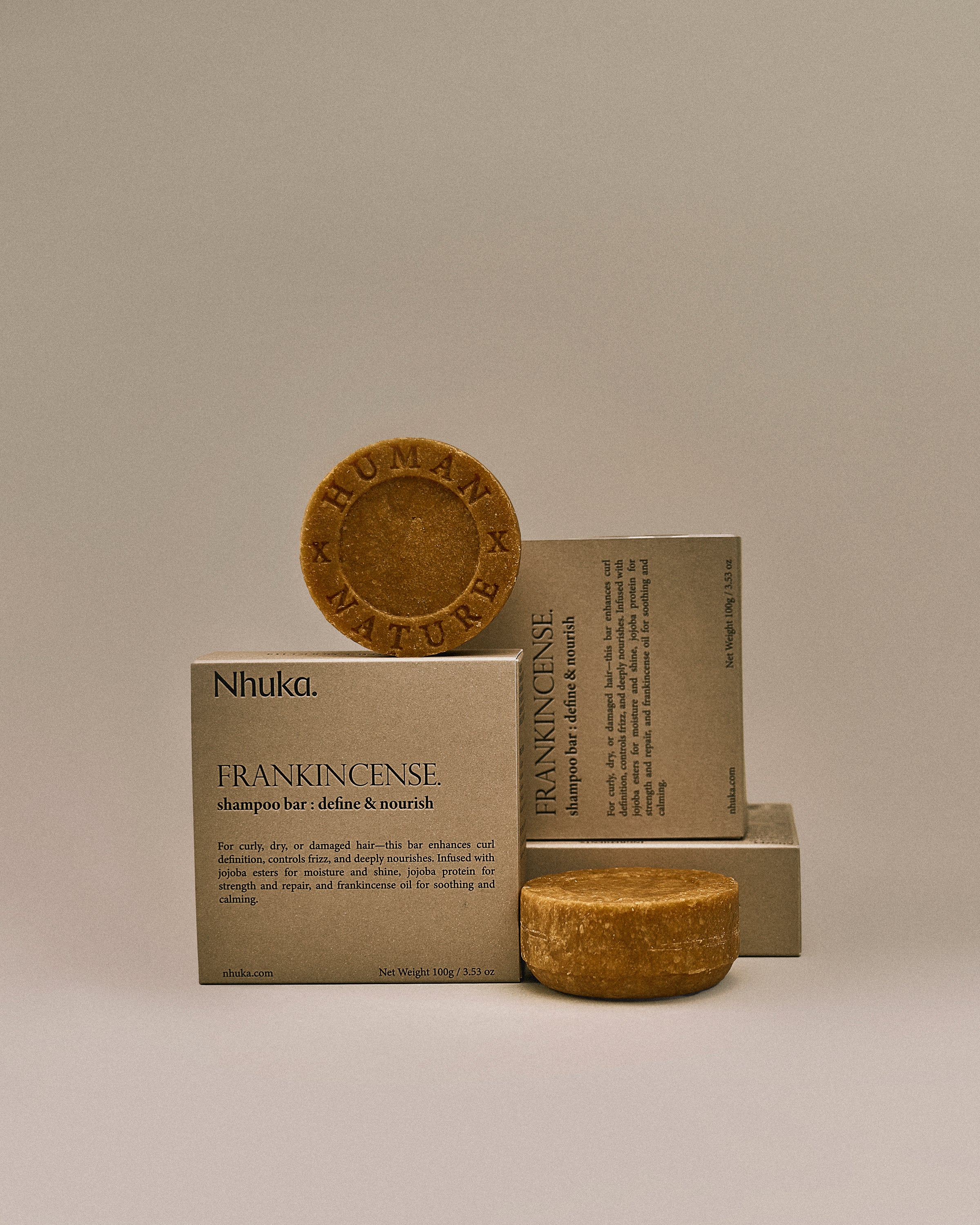Nhuka frankincense shampoo bar with FSC-certified packaging. Handmade in Australia, sulfate- and silicone-free, designed to define curls, nourish dry hair, and soothe the scalp.