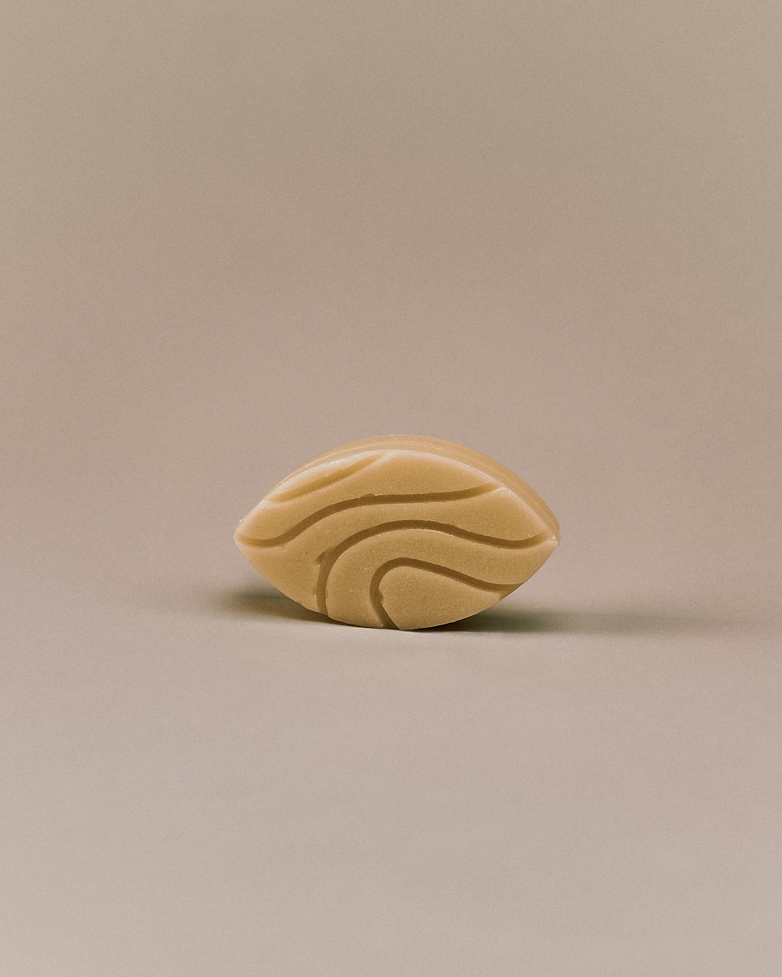 Nhuka organic jasmine conditioner bar viewed from the front, highlighting its leaf-shaped form and textured surface. Handmade in Australia, silicone-free, pH-balanced, and organic.