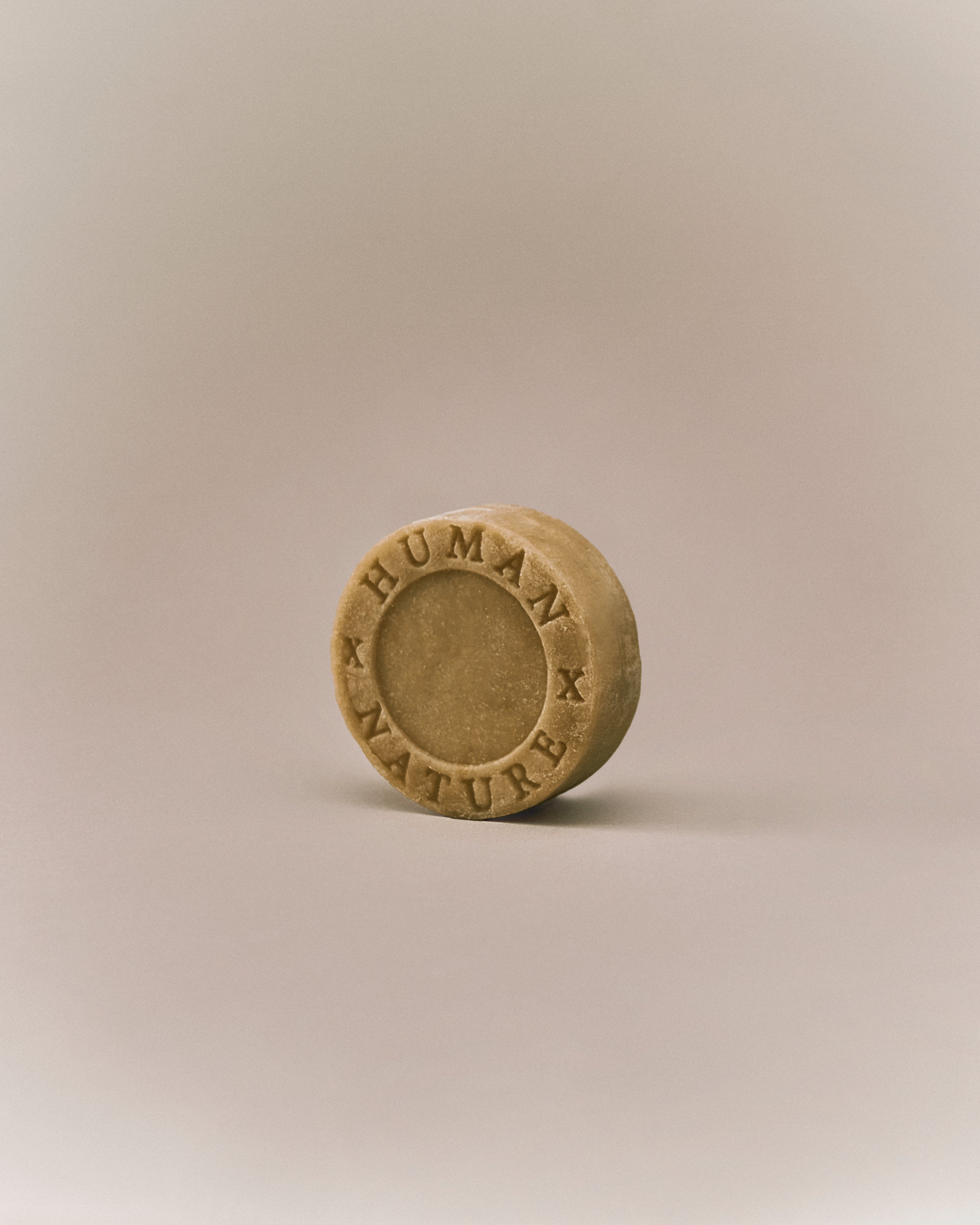 Nhuka organic kunzea shampoo bar shown at an angle. Handmade in Australia, solid, sulfate-free, silicone-free, and pH-balanced for sensitive scalps.