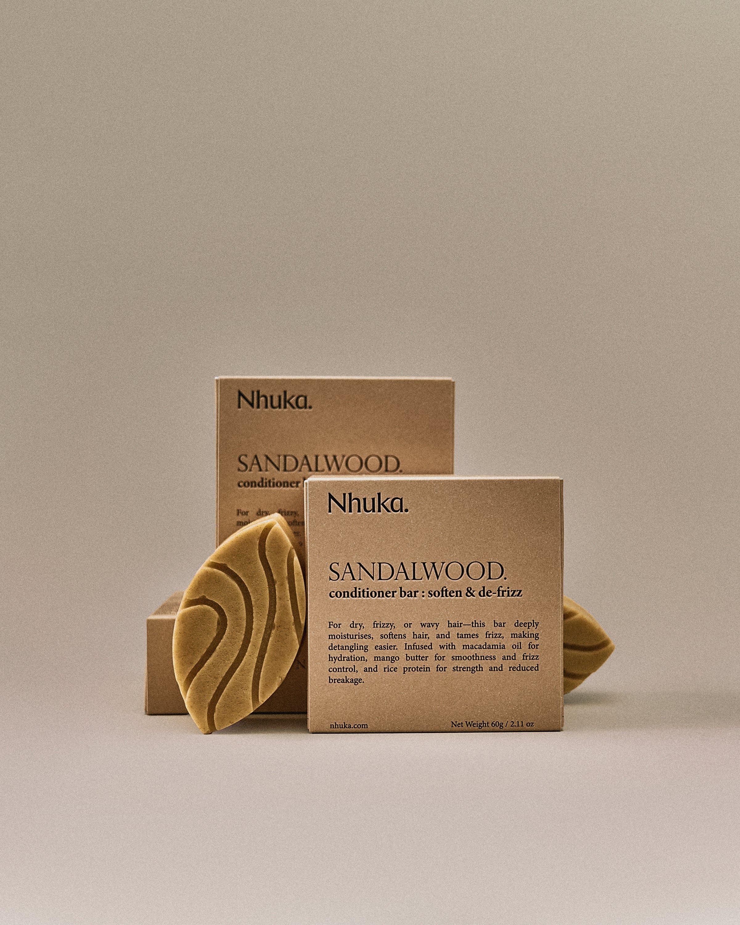 Nhuka sandalwood conditioner bar with FSC-certified packaging. Handmade in Australia, pH-balanced and silicone-free. Designed to moisturise, detangle, and reduce frizz in dry or wavy hair.