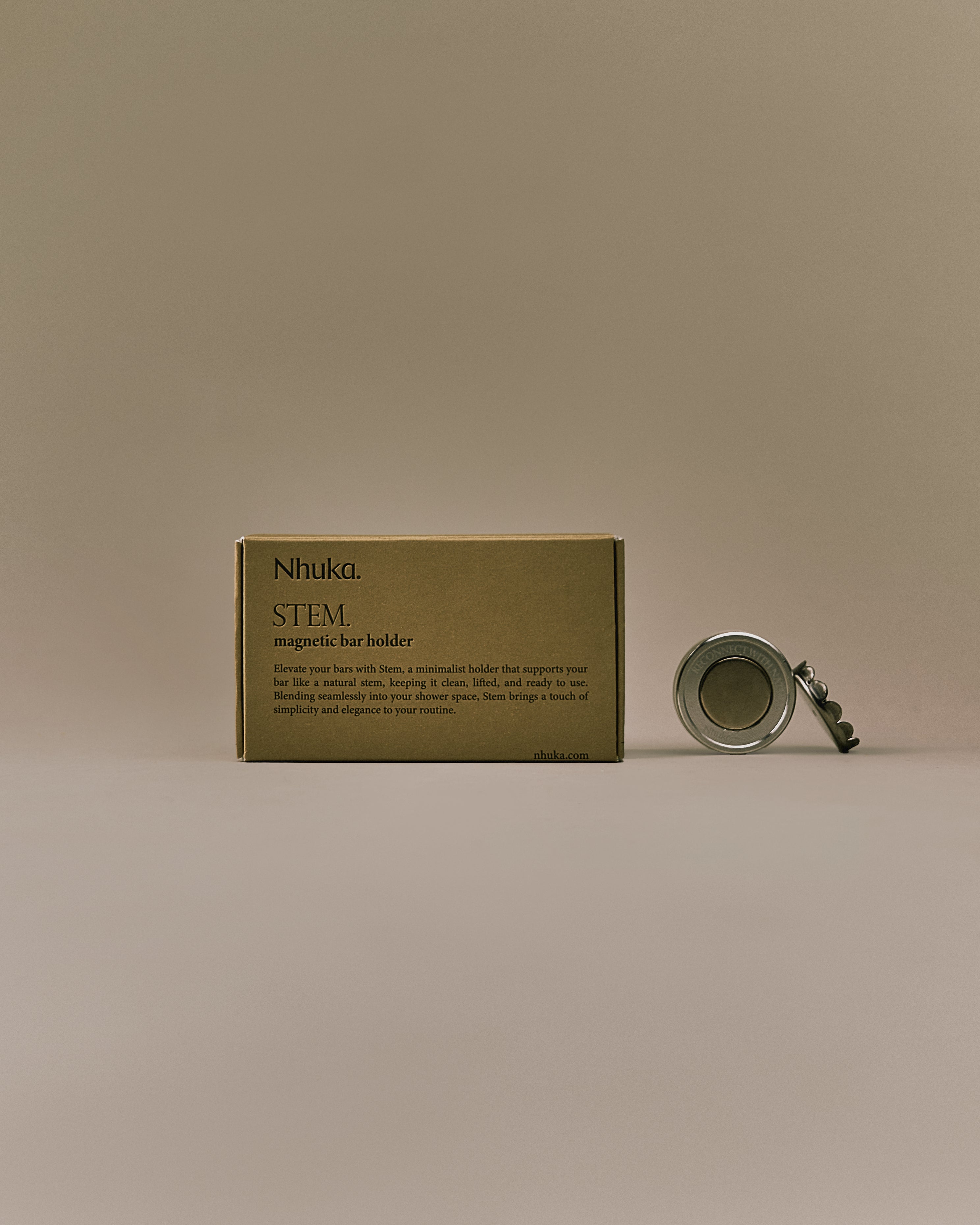 Nhuka Stem magnetic bar holder with packaging. Made from rust-proof aluminium and stainless steel. Keeps bars dry, clean, and convenient without plastic or drilling.