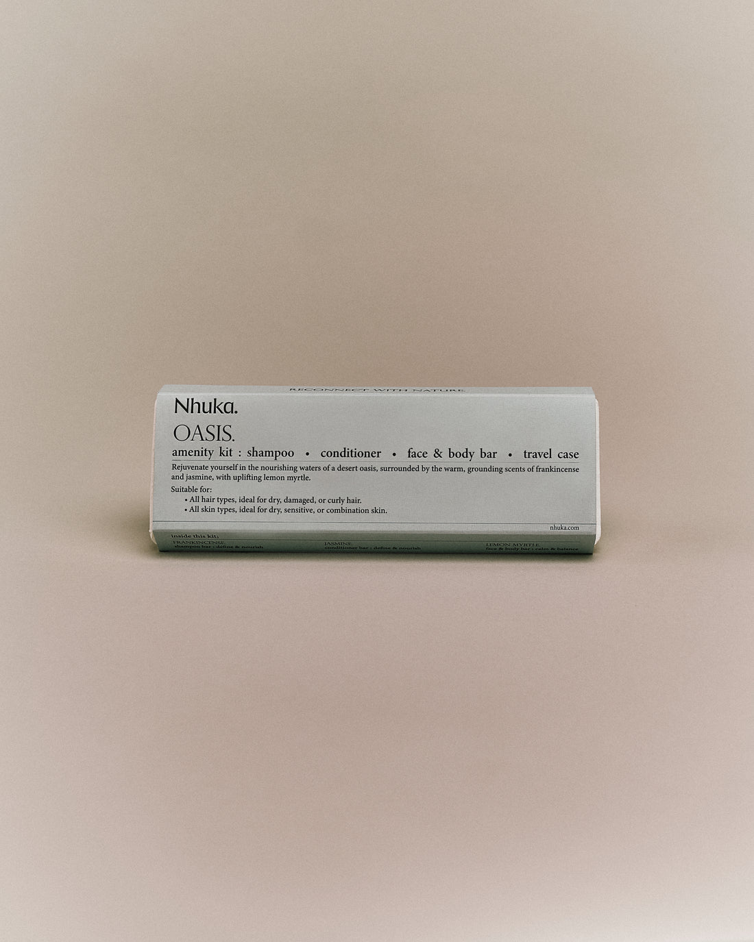 Oasis Amenity Kit with shampoo, conditioner, face &amp; body bar, and travel case. Features frankincense, jasmine, and lemon myrtle. Ideal for dry, curly hair and sensitive or combination skin.