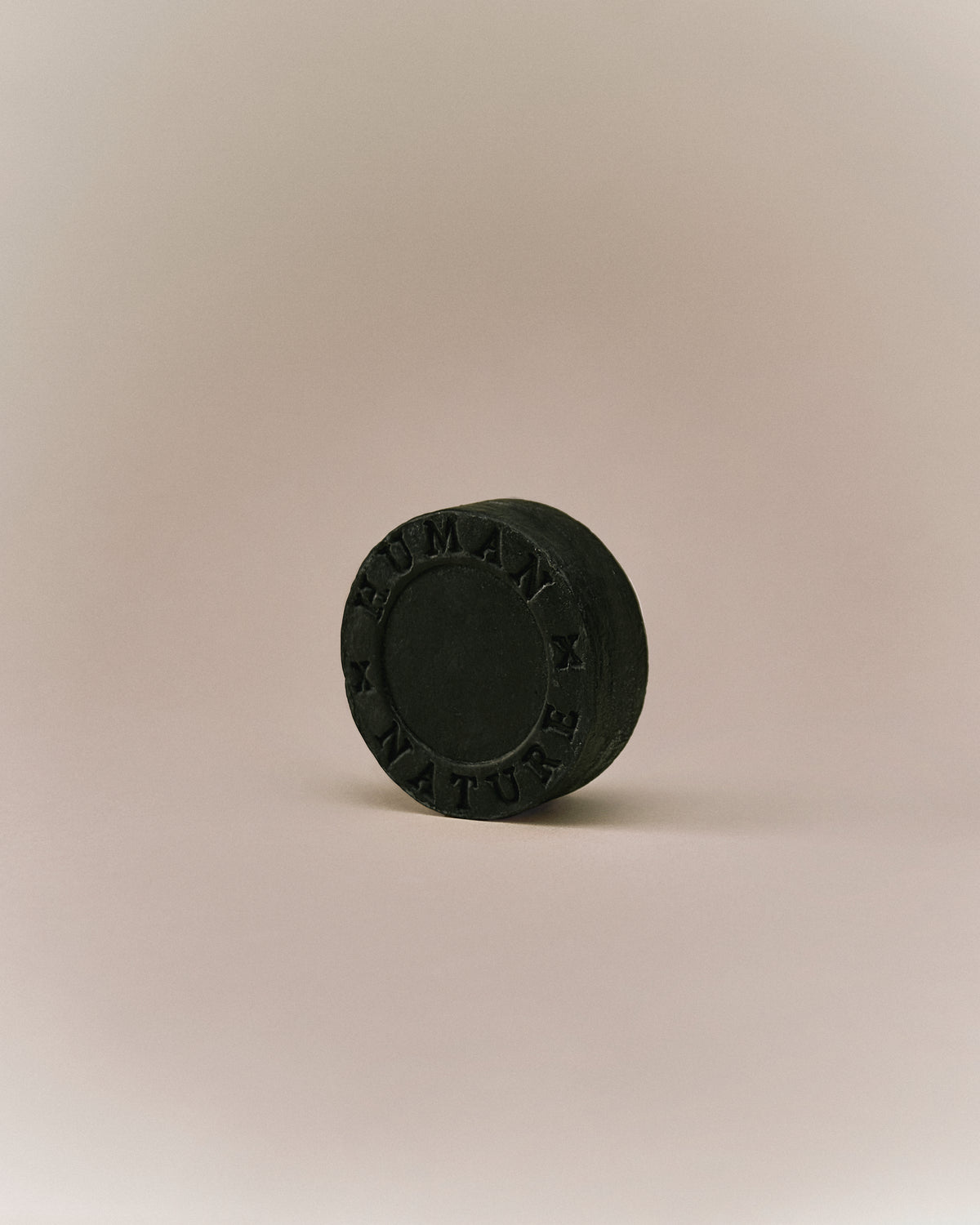 Nhuka eucalyptus shampoo bar photographed at an angle. Solid, pH-balanced, sulfate-free formula for oily hair and scalp care.