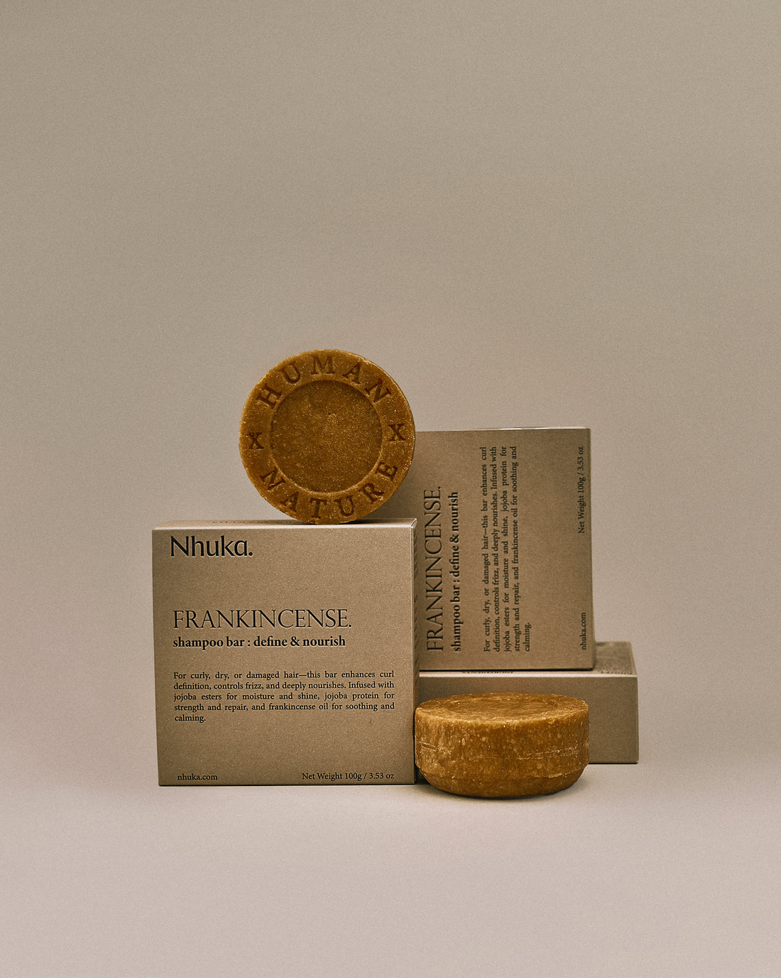 Nhuka frankincense shampoo bar with FSC-certified packaging. Handmade in Australia, sulfate- and silicone-free, designed to define curls, nourish dry hair, and soothe the scalp.
