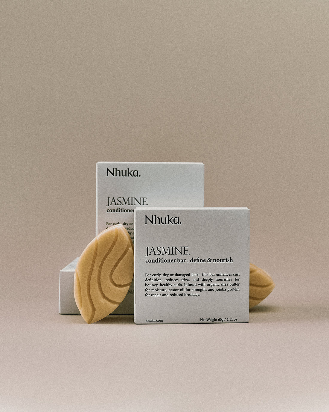 Nhuka jasmine conditioner bar with FSC-certified packaging. Handmade in Australia, silicone-free, pH-balanced, and organic — designed to nourish, define curls, and reduce frizz.