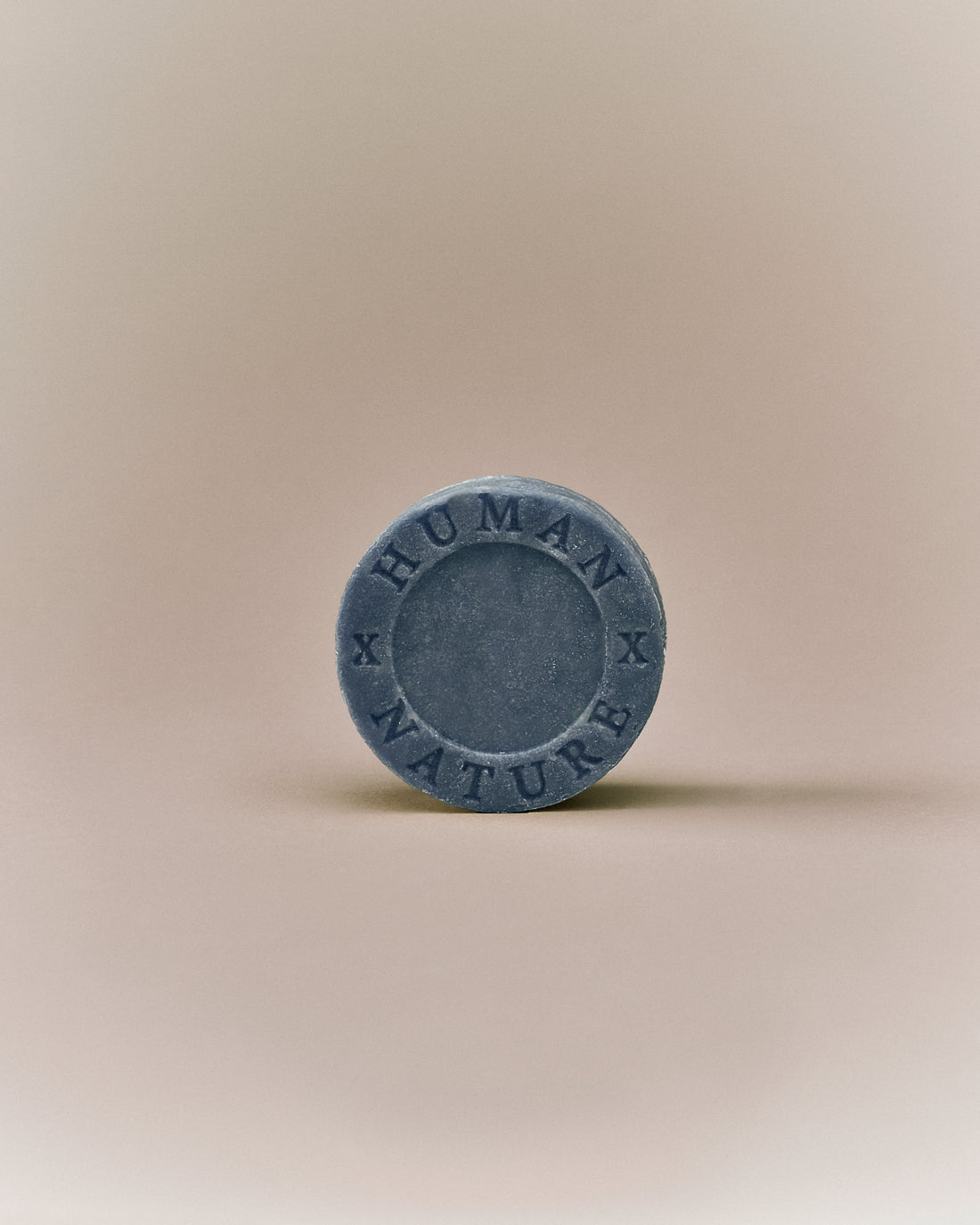 Nhuka lavender shampoo bar front-facing with Human x Nature stamp. Solid, pH-balanced, sulfate- and silicone-free, designed to soften and tame frizz.