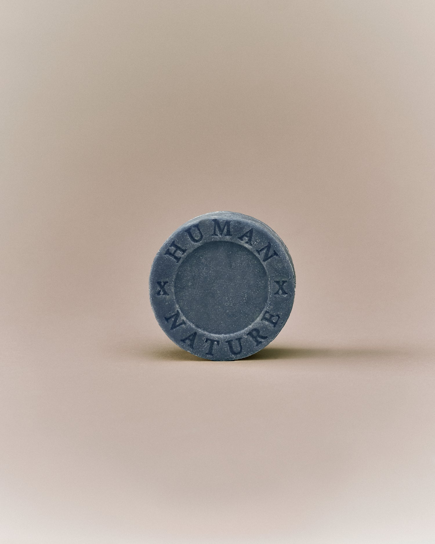 Nhuka lavender shampoo bar front-facing with Human x Nature stamp. Solid, pH-balanced, sulfate- and silicone-free, designed to soften and tame frizz.