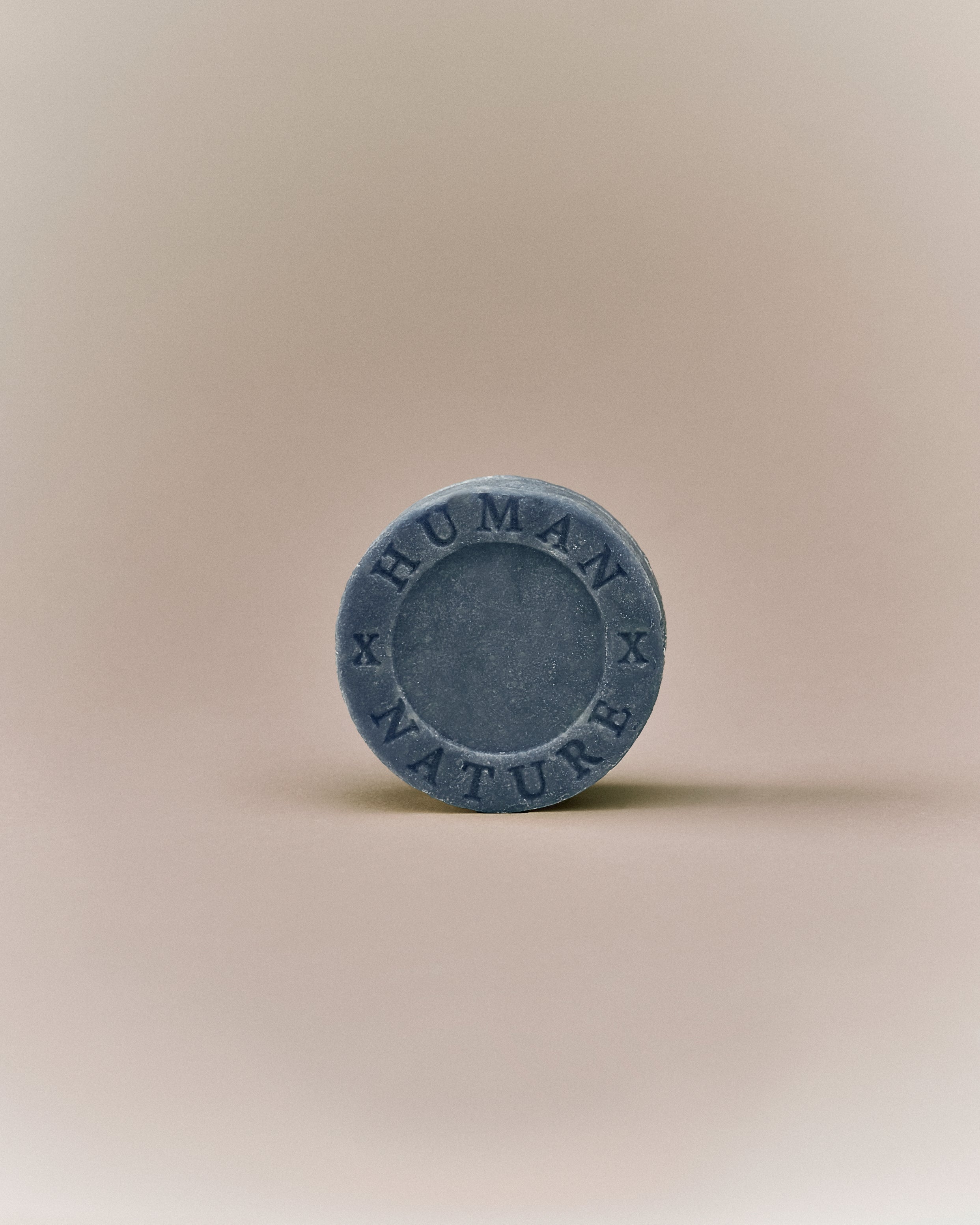 Nhuka lavender shampoo bar front-facing with Human x Nature stamp. Solid, pH-balanced, sulfate- and silicone-free, designed to soften and tame frizz.