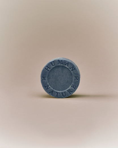 Nhuka lavender shampoo bar front-facing with Human x Nature stamp. Solid, pH-balanced, sulfate- and silicone-free, designed to soften and tame frizz.