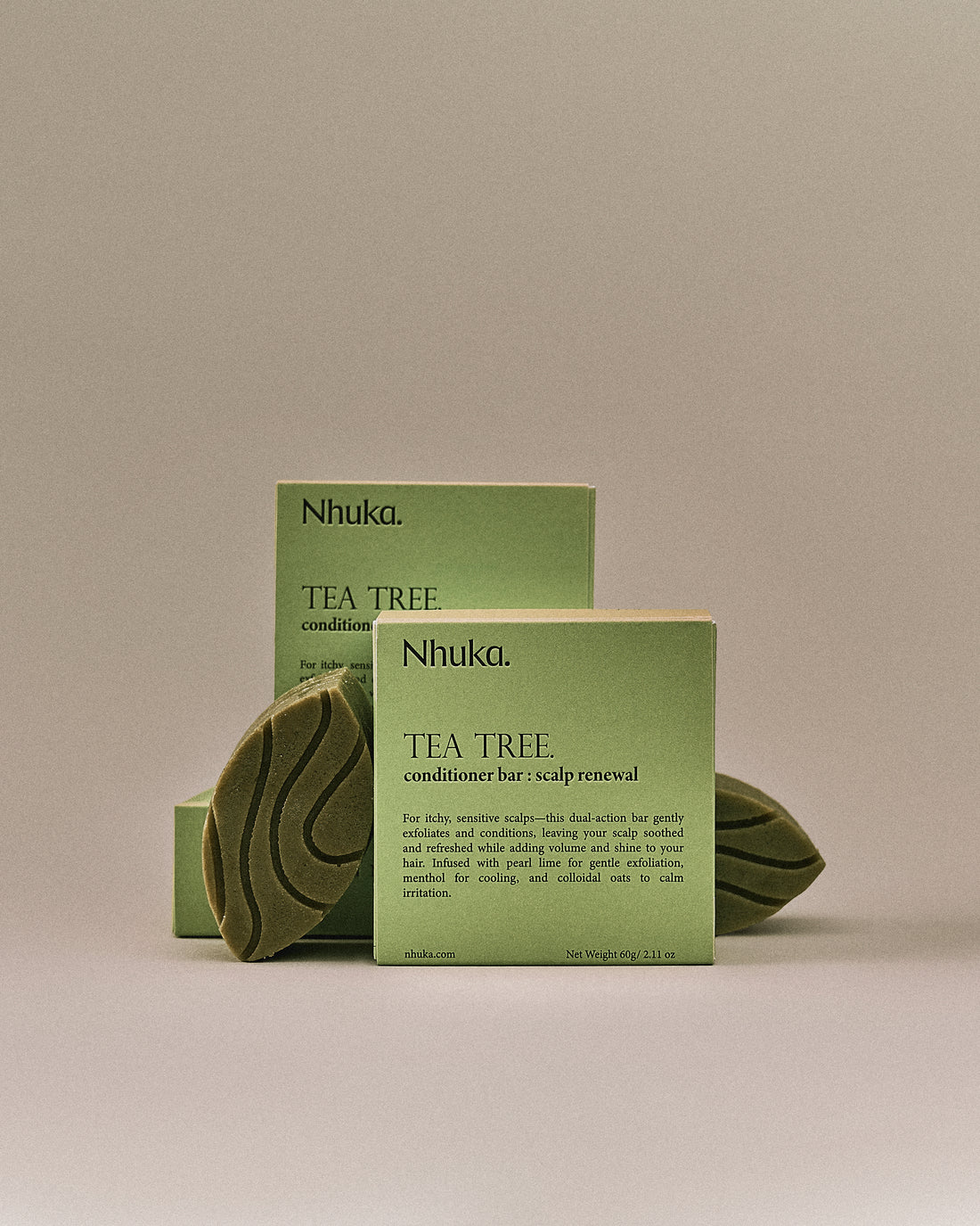 Nhuka Tea Tree conditioner bar with FSC-certified box. Handmade in Australia, sulfate- and silicone-free, pH-balanced for sensitive scalps and lightweight conditioning.