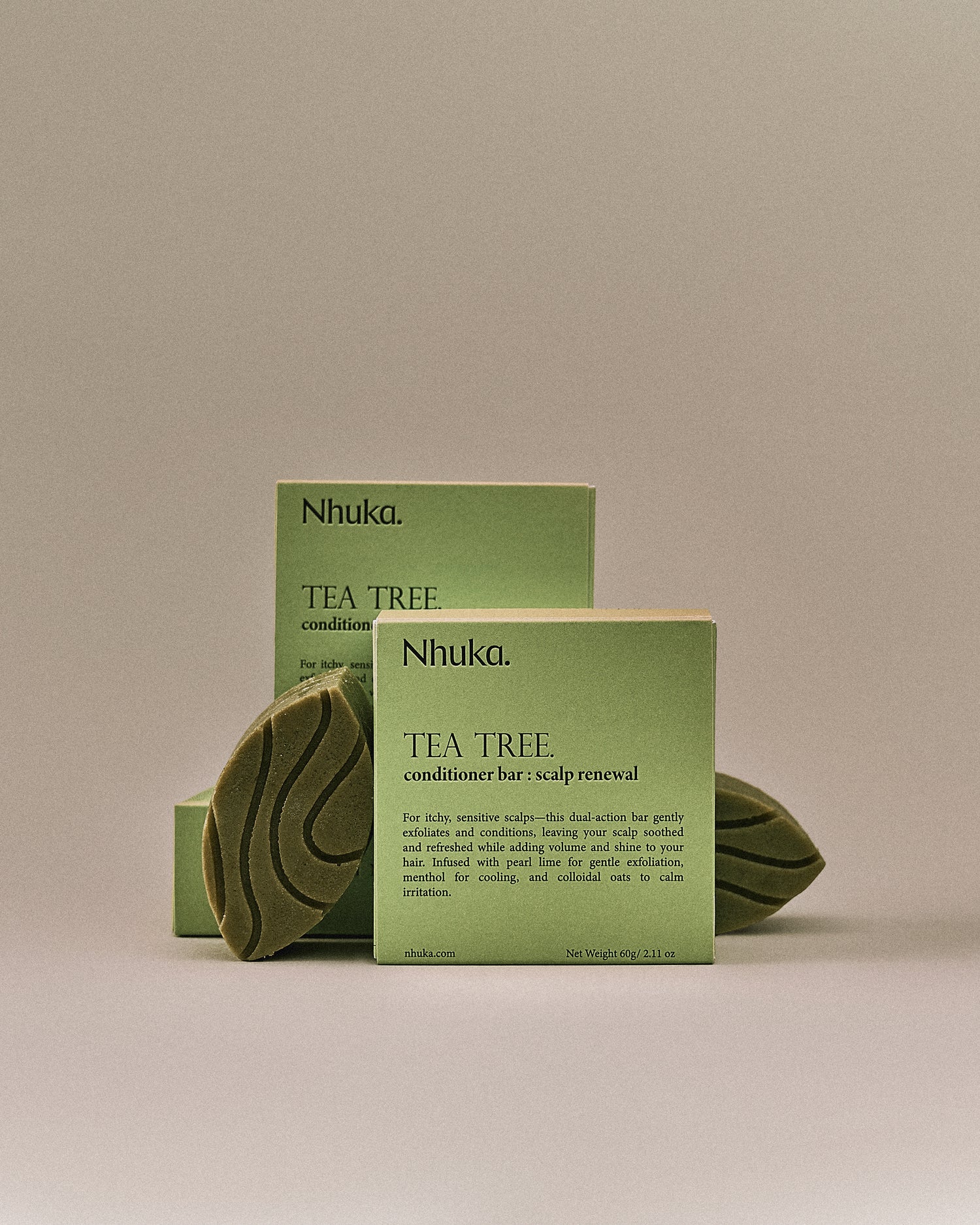 Nhuka Tea Tree conditioner bar with FSC-certified box. Handmade in Australia, sulfate- and silicone-free, pH-balanced for sensitive scalps and lightweight conditioning.